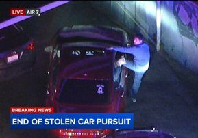 Orange County chase ends after authorities surround driver, passenger in suspected stolen car